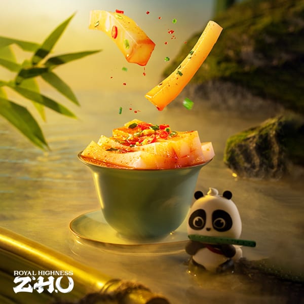 Spicy Chinese dish with red peppers and green onions, served in a green bowl with a panda figurine.